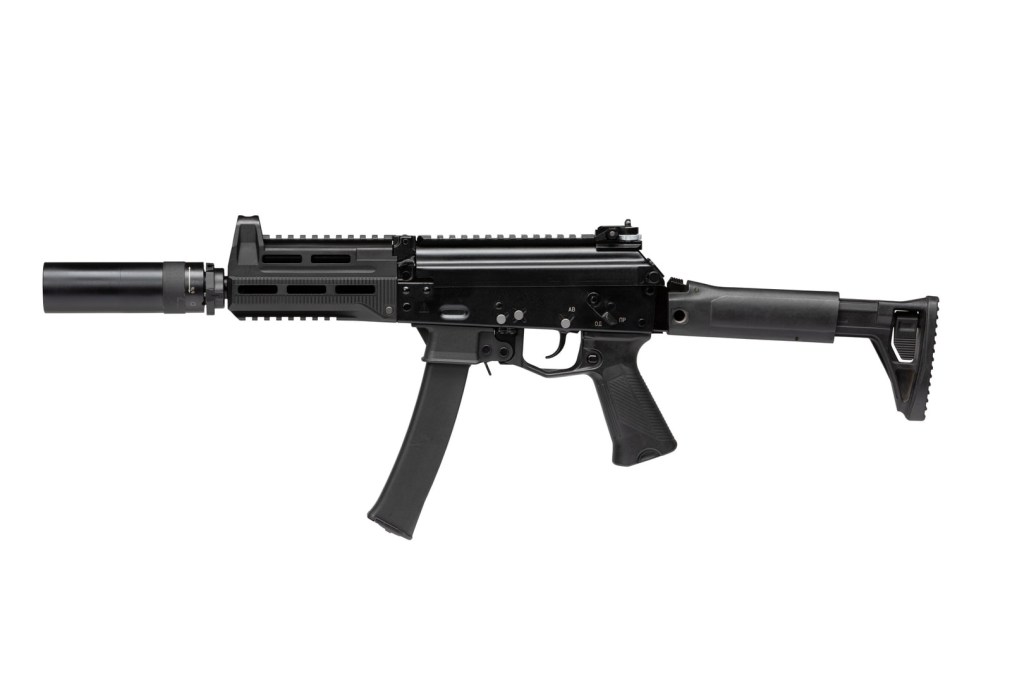 A black PPK-20 submachine gun with a suppressor attached, featuring a telescopic stock and Picatinny rail for mounting accessories.